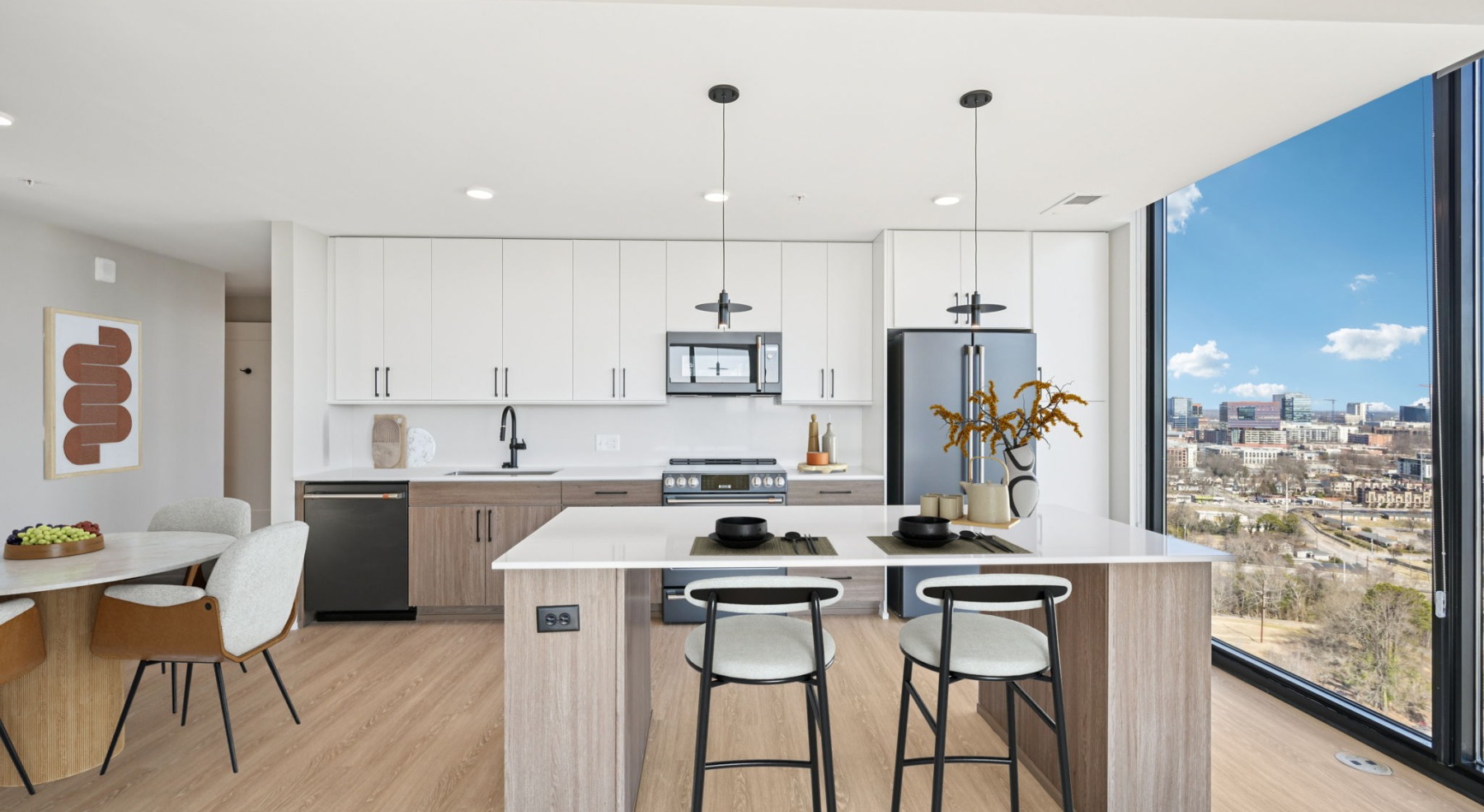 a modern kitchen with floor to ceiling windows