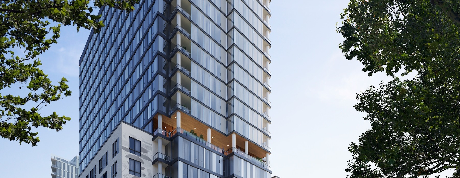 a tall building with a couple of people riding bikes out front