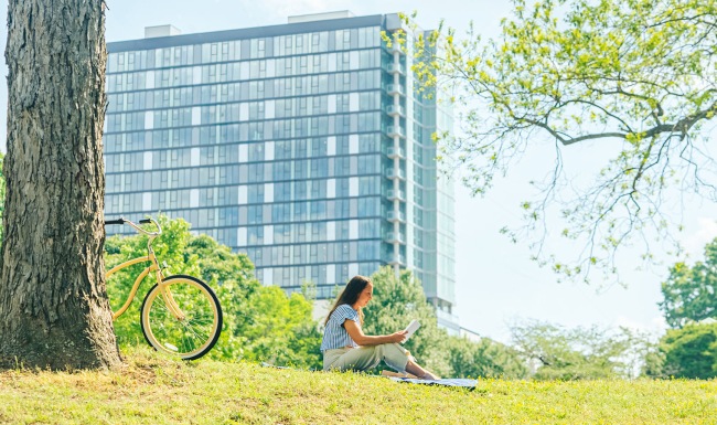 lady sitting under a tree