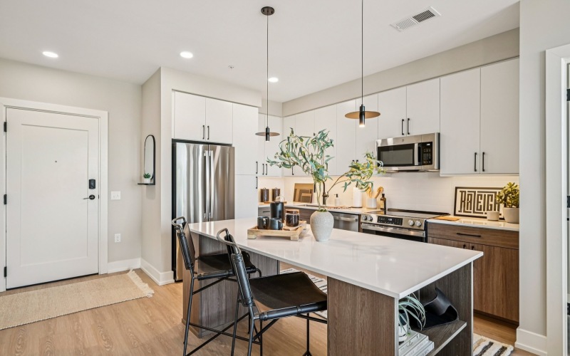 a kitchen with white cabinets