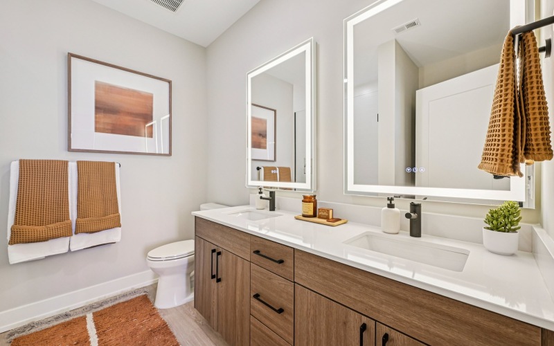 a bathroom with a sink and mirrors