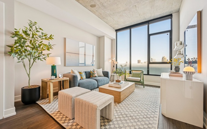 a living room with a couch and chairs