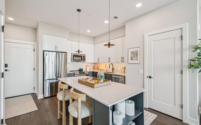 a kitchen with white cabinets